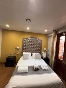 Postel nebo postele na pokoji v ubytování Hotel Melthon Class