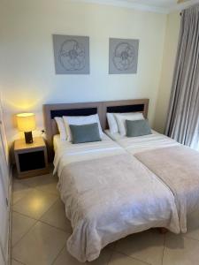 A bed or beds in a room at Villa Victoria With Heated Pool