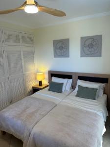A bed or beds in a room at Villa Victoria With Heated Pool