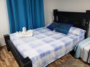Postel nebo postele na pokoji v ubytování Raizal house