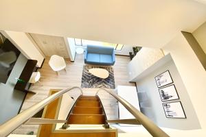 a view from the top of a staircase in a house at Domus Suites Chia in Chía