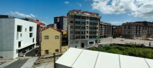 a view of a city with tall buildings at Alojamiento céntrico Ribeira con parking sin ascensor in Ribeira