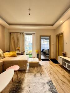 a large bedroom with a bed and a large window at Oakley Apartment- By Tito Homes in Nairobi