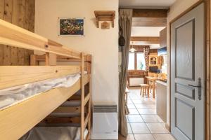 a room with two bunk beds and a kitchen at Studio Cabine Saint-Gervais in Saint-Gervais-les-Bains +17 photos