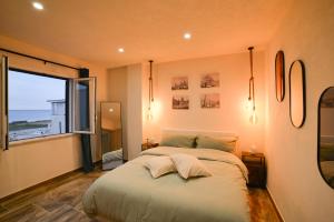 Postel nebo postele na pokoji v ubytování Isula SeaView Apartments