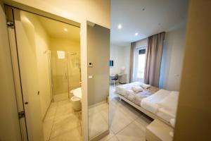 Posteľ alebo postele v izbe v ubytovaní CATANIA LIVING ROOMS