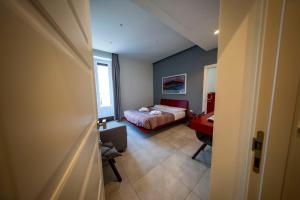 Posteľ alebo postele v izbe v ubytovaní CATANIA LIVING ROOMS