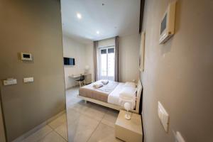 Posteľ alebo postele v izbe v ubytovaní CATANIA LIVING ROOMS