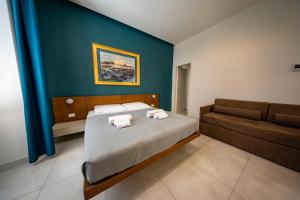 Posteľ alebo postele v izbe v ubytovaní CATANIA LIVING ROOMS
