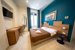 Posteľ alebo postele v izbe v ubytovaní CATANIA LIVING ROOMS