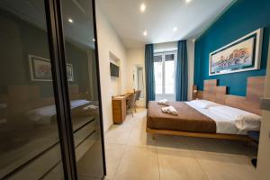 Posteľ alebo postele v izbe v ubytovaní CATANIA LIVING ROOMS