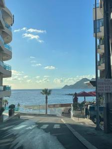 a view of the ocean from a street at Darija in Dobra Voda