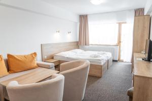 A bed or beds in a room at Hotel Toliar