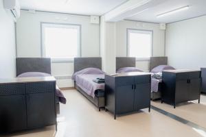 Postel nebo postele na pokoji v ubytování Pabrades Apartamentai