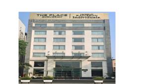 a building with a sign on the side of it at The Place Gurugram, a member of Radisson Individuals in Gurgaon