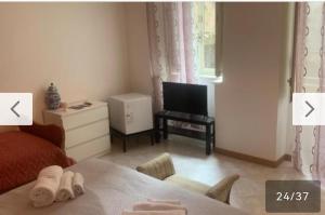 TV a/nebo společenská místnost v ubytování Mille e una notte house