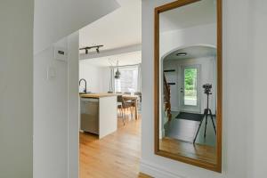 a mirror in the hallway of a home at 891 shefford 4-bedroom house in Bromont