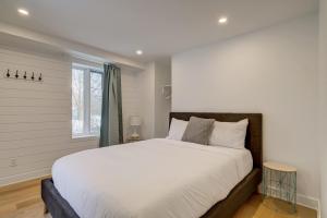 a bedroom with a large bed and a window at 951 Shefford 4 bedrooms house in Bromont