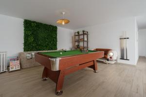 a living room with a pool table in it at Paradise Villa Sky - Signature by Paradise Portugal in Ribamar