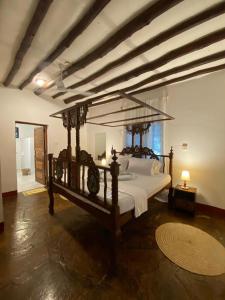 Ένα ή περισσότερα κρεβάτια σε δωμάτιο στο Villa Tata Diani