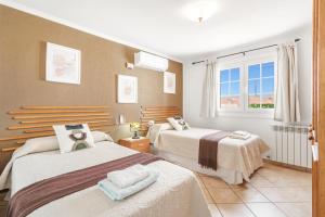 A bed or beds in a room at Villa Ingrid