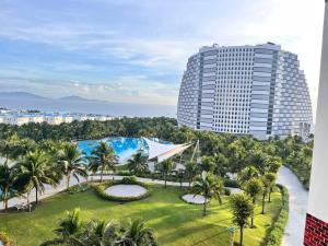 an aerial view of a resort with a pool and a building at Bai Dai Cam Ranh Apartment in Cam Ranh International Airport
