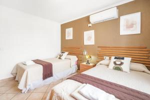 A bed or beds in a room at Villa Ingrid