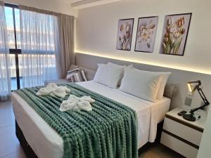 Postel nebo postele na pokoji v ubytování Requinte e conforto a beira-mar + 37 fotografií