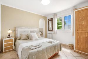 A bed or beds in a room at Villa Ingrid