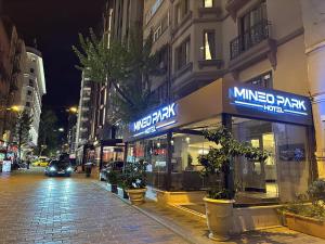 a city street at night with aumed play store at Mineo Park Hotel in Istanbul +9 photos