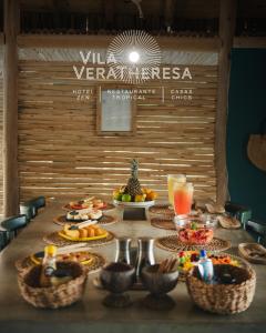 a table with a bunch of food on it at Hotel VilaVeraTheresa in Fortim +268 photos