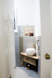 a bathroom with a sink and a mirror at Luxury Apartment by Hi5 - Best Location 3-br in Budapest +60 photos