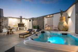a hot tub in the middle of a living room at Chrispa Villa in Afantou
