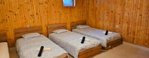 Ένα ή περισσότερα κρεβάτια σε δωμάτιο στο Helena Hostels