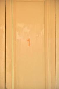 a door with the number one on it at Liberty House in Turbigo