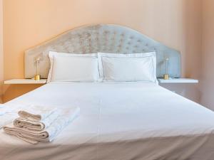 Ένα ή περισσότερα κρεβάτια σε δωμάτιο στο Luxury Sant'Ambrogio Apartment