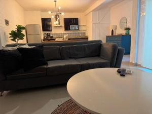 a living room with a couch and a table at TENDA Comfortable Apartments in Playa del Carmen