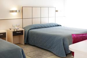 Voodi või voodid majutusasutuse Hotel Miorelli toas