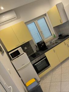 Kuchyň nebo kuchyňský kout v ubytování Apartments Lota