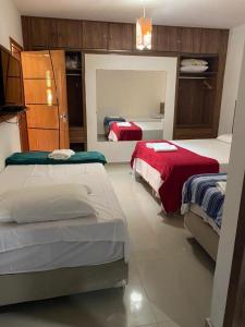 a bedroom with two beds in a room at Flete Pé na Areia - Barra Grande in Marau