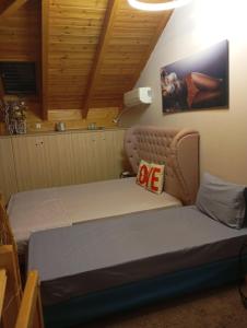 a bedroom with a bed in a room at Αρχωντικα στην Τρiχονιδα in Agrinio