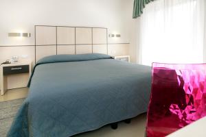 Voodi või voodid majutusasutuse Hotel Miorelli toas