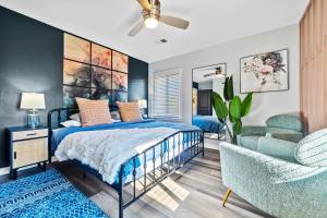 a bedroom with a bed and a chair at East Atlanta Retreat with 2 Homes Sleeps 16 and Pet Friendly in Decatur