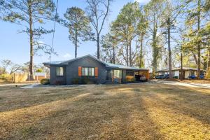 a small house in the middle of a yard at East Atlanta Retreat with 2 Homes Sleeps 16 and Pet Friendly in Decatur