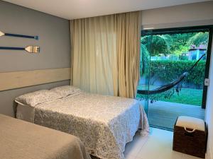 Postel nebo postele na pokoji v ubytování Lindo chalé em Carneiros com piscina privativa, 4Quartos