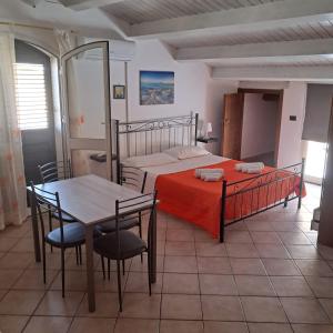 A bed or beds in a room at Casa Vacanza Miramare