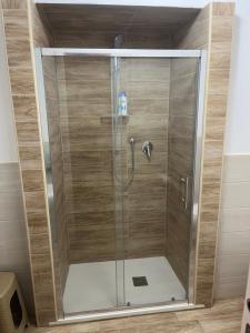 a shower with a glass door in a bathroom at Il portale in Tropea