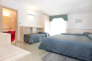 Voodi või voodid majutusasutuse Hotel Miorelli toas