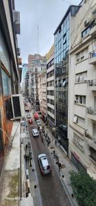 a busy city street with cars and buildings at Hospedaje reconquista in La Porteña