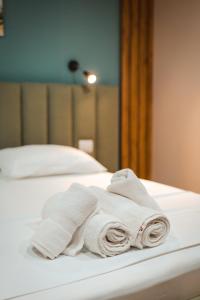 Postel nebo postele na pokoji v ubytování The Blue Wave Hotel